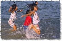 Children playing in the surf